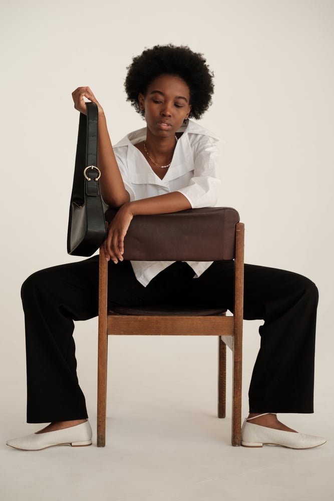 Woman in Casual Dress Shirt and Black Purse