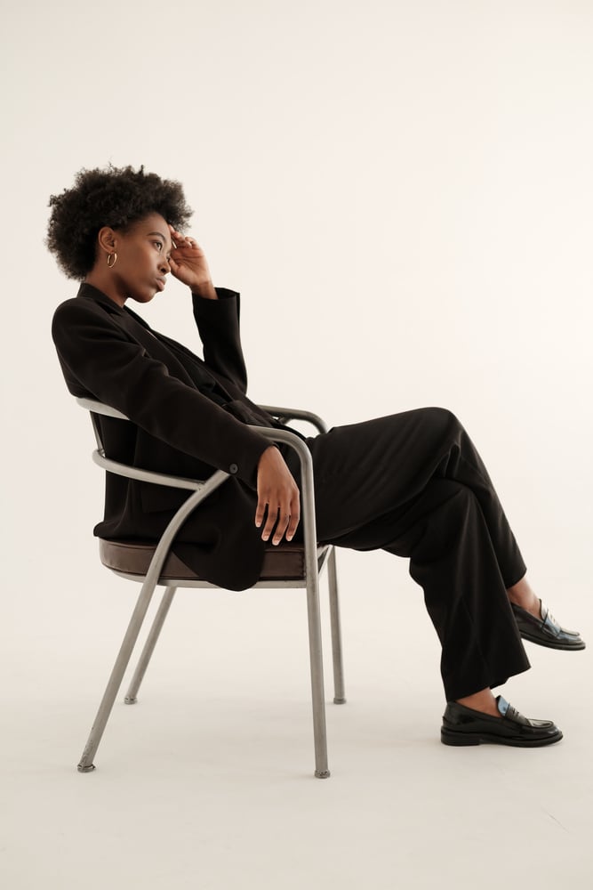 Woman in Black Blazer, Slacks and Loafers